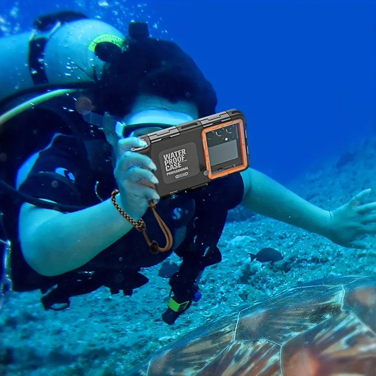 Diver holding a waterproof camera underwater