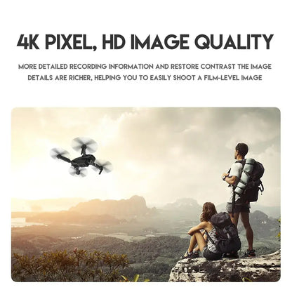 Two people with backpacks overlooking a scenic landscape with an E88 Pro drone flying above
