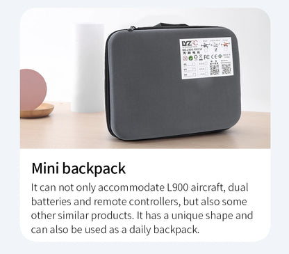 Black mini backpack with a label on a light surface