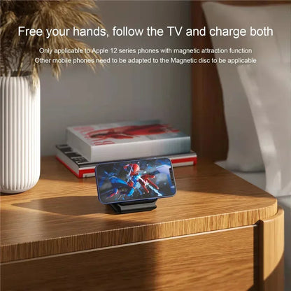 Phone on a stand with screen displaying a superhero graphic, placed on a wooden surface with text about phone compatibility.