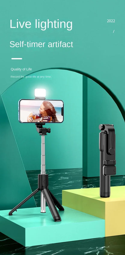 Smartphone with selfie stick and light on a green platform with '2022' text.