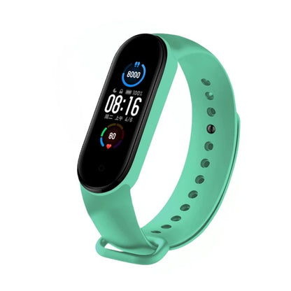 Mint green fitness tracker with a black screen on a white background