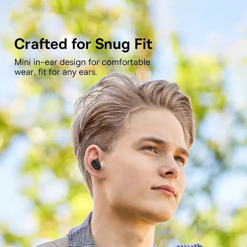 Person wearing wireless earbuds in an outdoor setting with text highlighting a snug and secure fit
