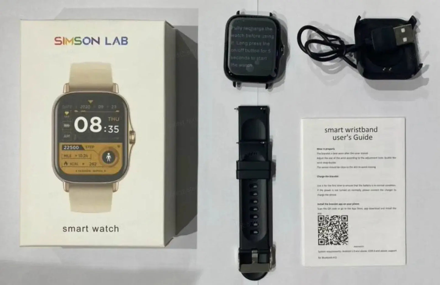 Smartwatch with packaging, strap, and user guide displayed on a gray surface

