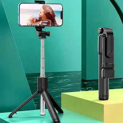 Phone holder with tripod and remote control on a green and yellow geometric background
