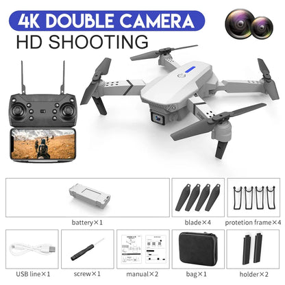 Drone with remote control, camera, and accessories on a white background
