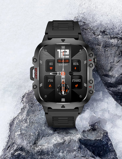 Black rugged smartwatch on a rocky surface